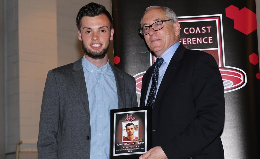 Liam Haycock (left) receives the John Smillie, Jr. award from ECC Commissioner Bob Dranoff.