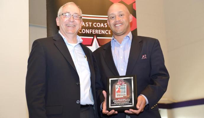 Head Coach Dickie Mahaffey accepts the ECC Male Scholar-Athlete of the Year Award on behalf of Miguel Uzcategui