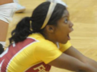 Carmen Smith digs the ball